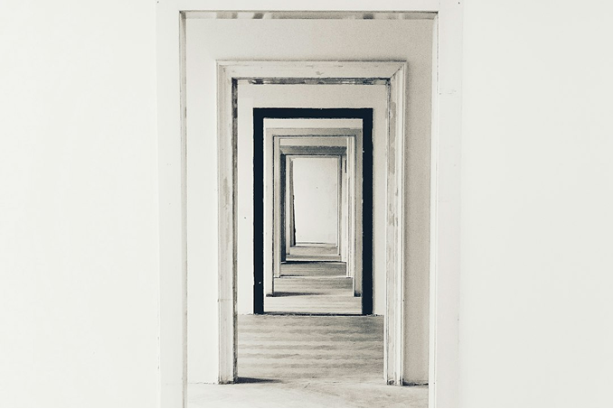 Minimal architectural space with receding doorways