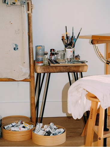 Studio table with identity sketches and printed mockups